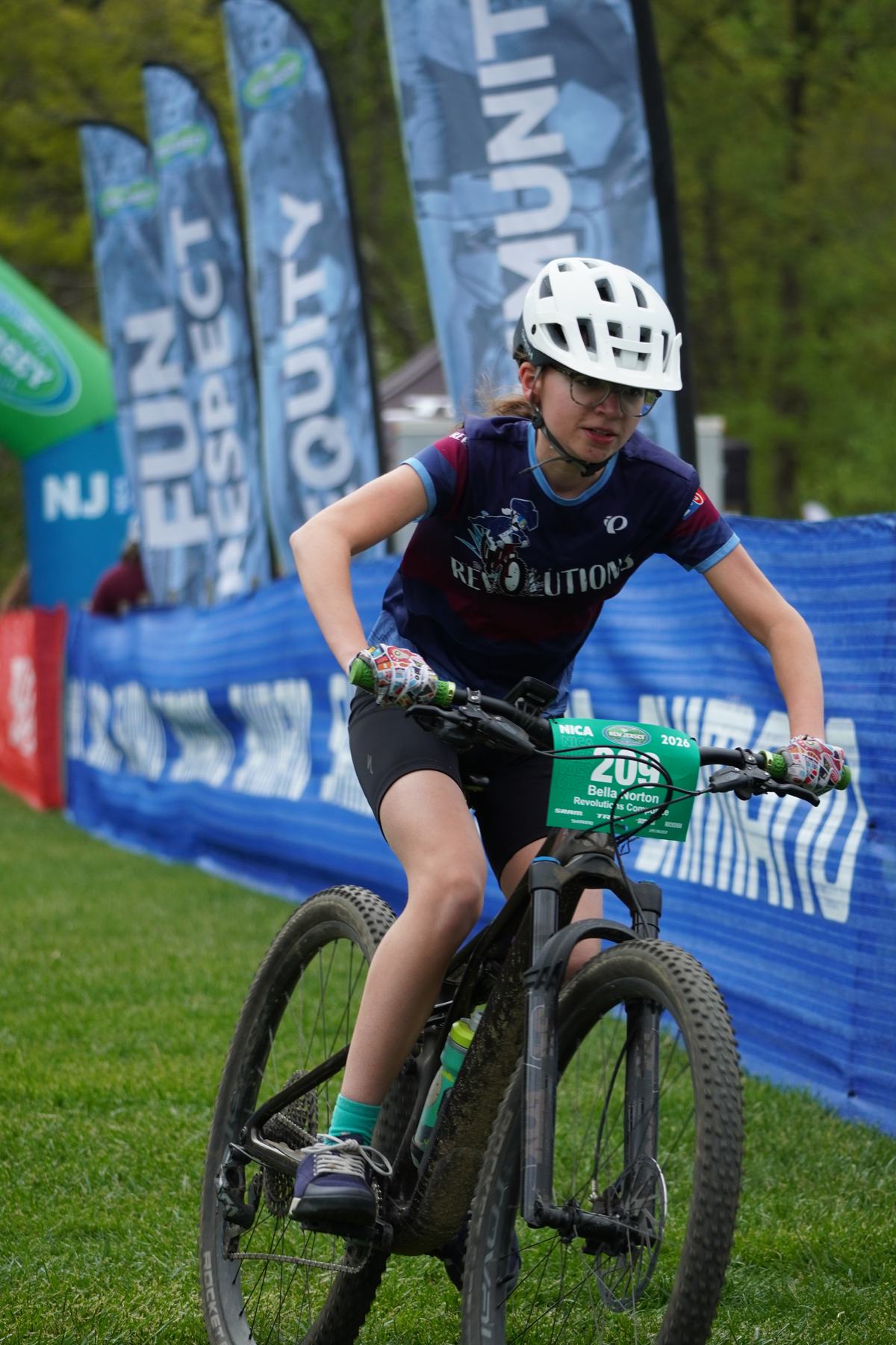Rider sprinting past the barriers