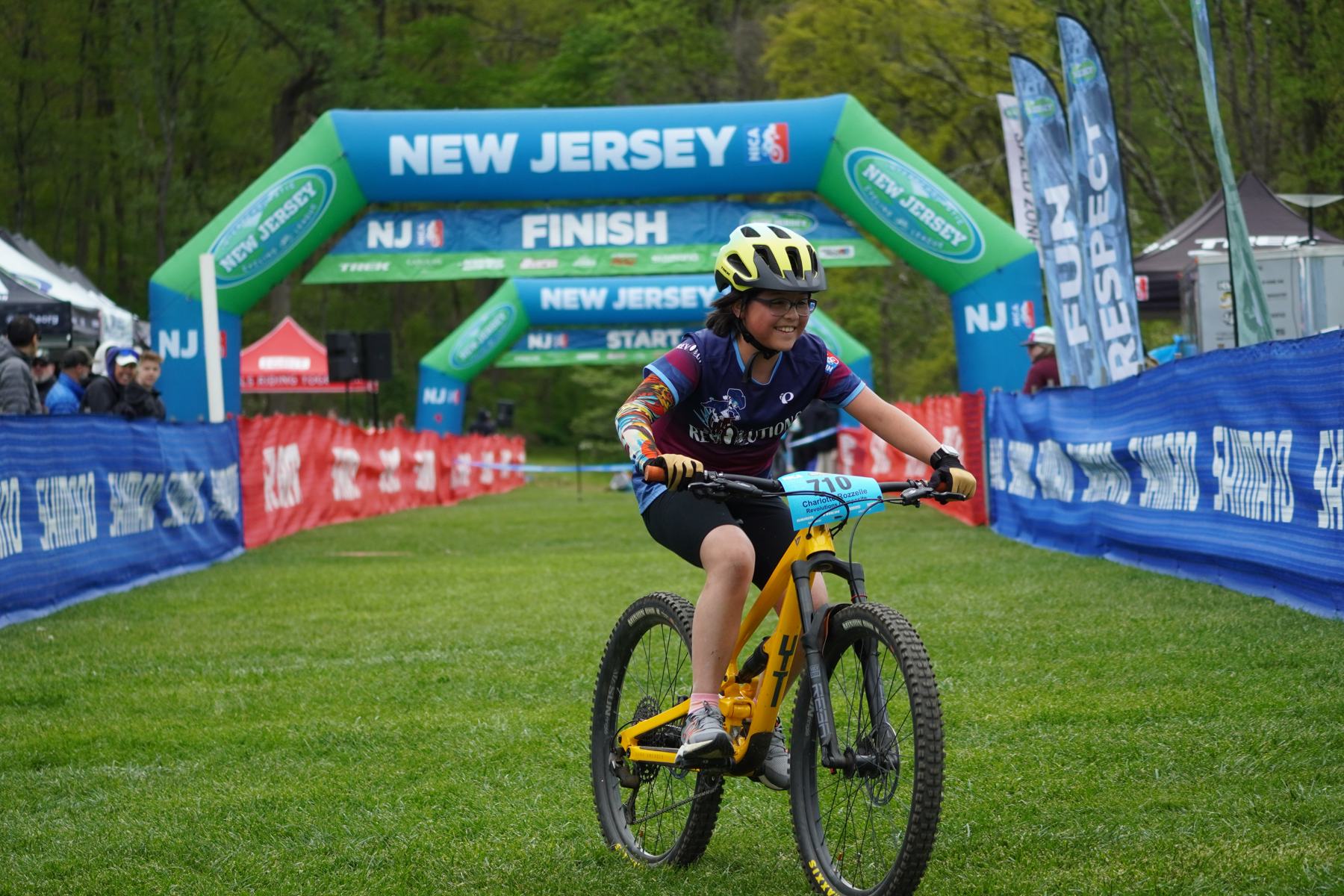 A young rider at the finish arch