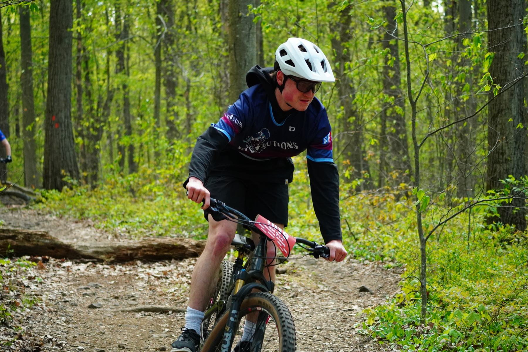 Rider dropping into a rocky section