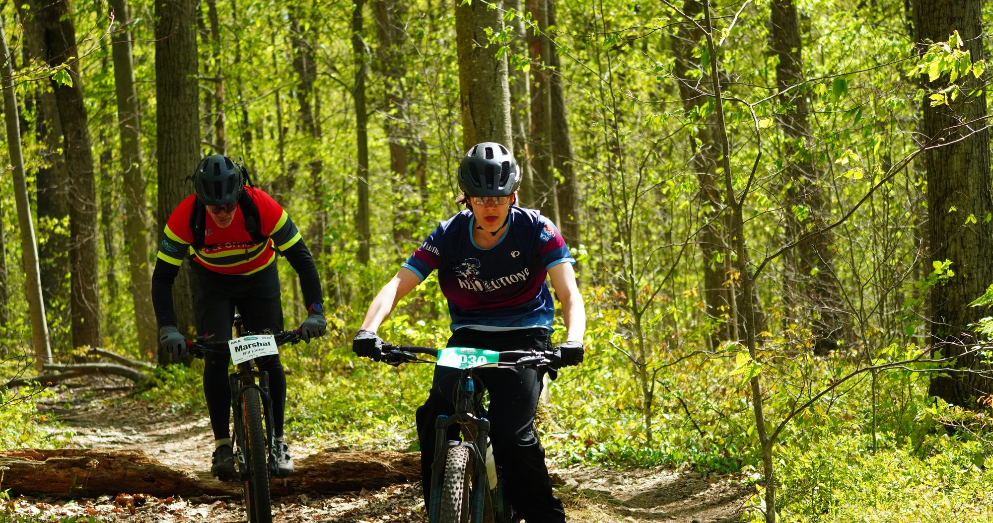 Two riders side by side on the trail